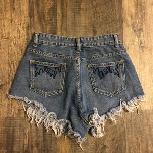 SHEIN shorts with black flames on pockets